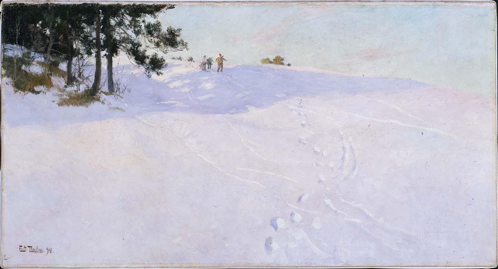 Skiers at the Top of a Snow-covered Hill